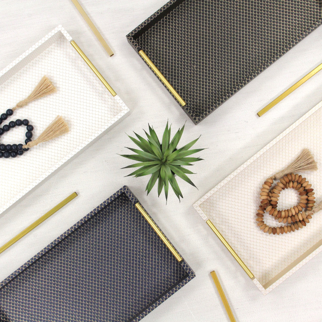 A top down picture of 4 fish-scale trays with decorative tassels on top.